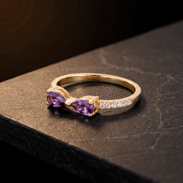 The Bowline Ring resting on dark basalt stone