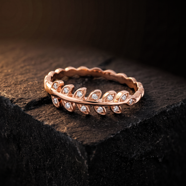 The Laurel Ring resting on dark basalt stone