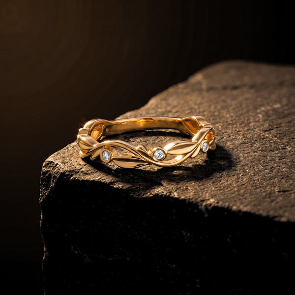 The Ivy Ring resting on dark basalt stone