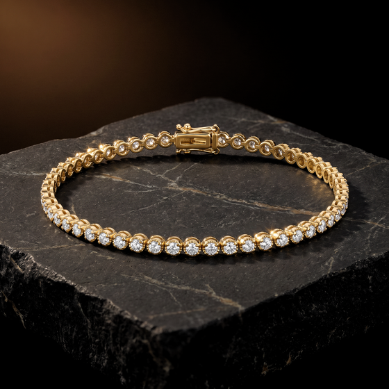 The Causeway Bracelet, a line of cup set natural diamonds in yellow gold with a box clasp, on dark stone